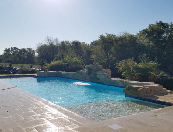 Rock wall around custom pool - Swimming Pools Service & Repair in Abilene, KS