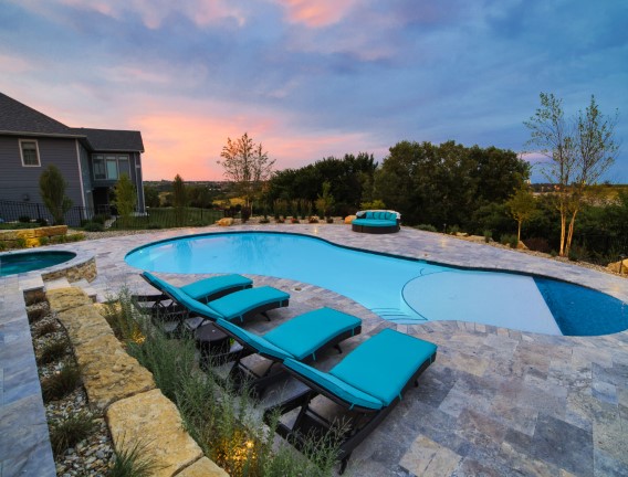 Pool chairs with a beautiful cloudy sunset - Swimming Pools Service & Repair in Abilene, KS